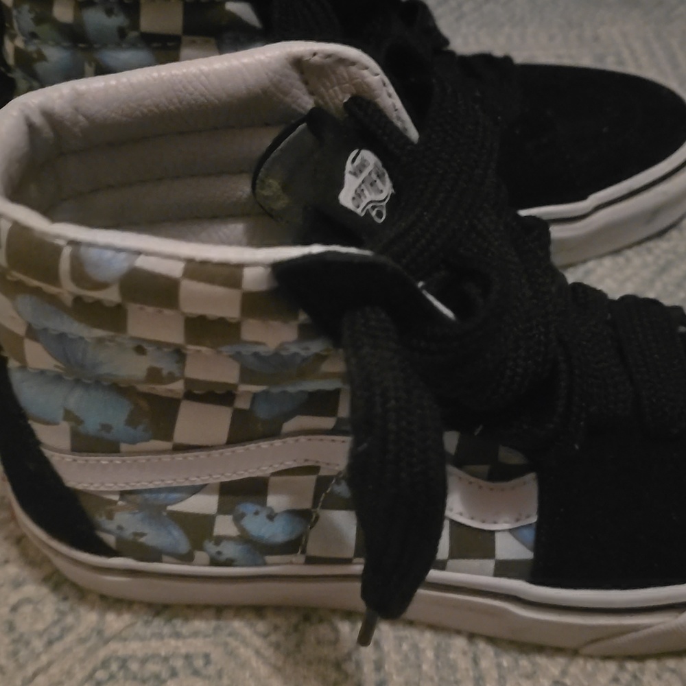 Vans hightops white and black with blue butterflies on them